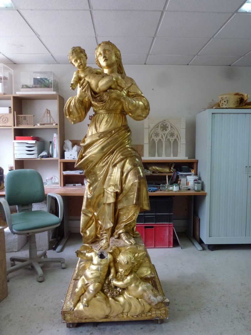 Atelier Giordani - Conservation - Restauration
Edifice – Mobilier - Sculpture – Objets d’art – Moulage –
Pierre, bois métal, polychromie et dorure - Restauration et soclage de la Vierge à l’Enfant - Bois doré, mixtion et détrempe - OPÉRATIONS RÉALISÉES
- Nettoyage chimique 
- Mastics traditionnels craie-colle et modostucs®
- Consolidation du  bois
- Restitution et compléments par moulage
- Réintégration à la feuille d’or et patine d’harmonisation
- Réintégrations colorées à l’or minéral 
- Réalisation d’un socle mobile en chêne teinté qui encastre et conserve le système d’origine