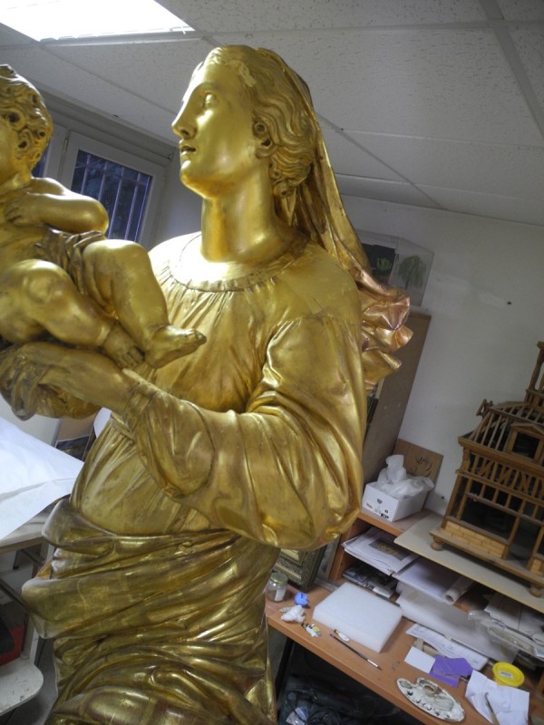 Atelier Giordani - Conservation - Restauration
Edifice – Mobilier - Sculpture – Objets d’art – Moulage –
Pierre, bois métal, polychromie et dorure - Restauration et soclage de la Vierge à l’Enfant - Bois doré, mixtion et détrempe - OPÉRATIONS RÉALISÉES
- Nettoyage chimique 
- Mastics traditionnels craie-colle et modostucs®
- Consolidation du  bois
- Restitution et compléments par moulage
- Réintégration à la feuille d’or et patine d’harmonisation
- Réintégrations colorées à l’or minéral 
- Réalisation d’un socle mobile en chêne teinté qui encastre et conserve le système d’origine